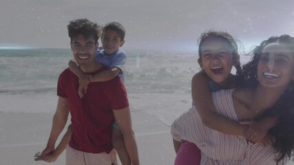 Animation of light trails over family walking at beach - Powered by Adobe