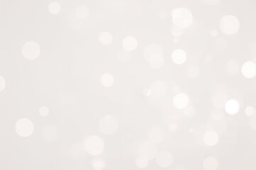 High-quality bokeh images for banners and posters featuring vivid and stylish hues. Soft white bokeh spots dispersed over a light-colored background.