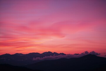 Magenta twilight behind the hills