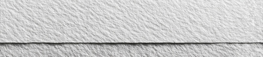 Close-up view of a textured, light gray material with a subtle, repeating pattern