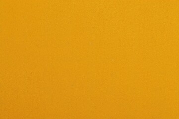 Obraz premium Warm yellow wool texture background with unique felt fabric pattern