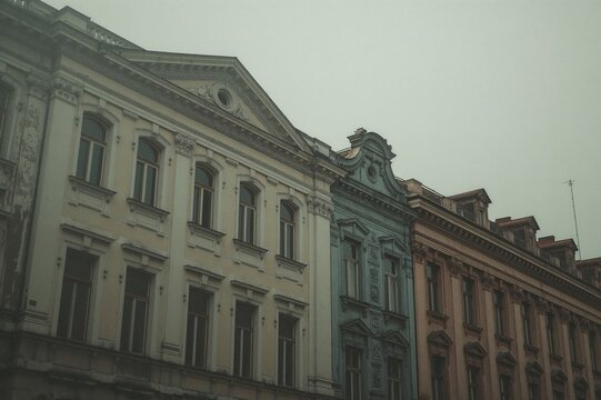 Vintage Soviet-era panel houses against a washed-out backdrop - Powered by Adobe