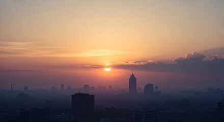 City skyline silhouette against a vibrant sunset sky with clouds and hazy atmosphere in the distance