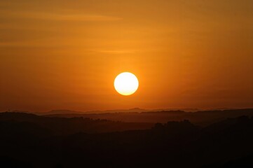 Fototapeta premium When the sun is close to the horizon, sunlight travels through more atmosphere, decreasing the strength of direct light.