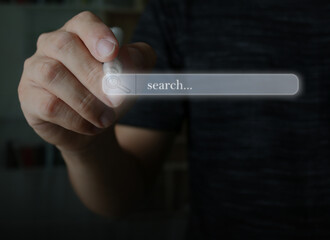 Hand interacting with virtual search bar which shows the text 