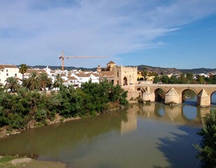 Fototapeta premium Panoramic view of a Spanish city with a river and bridge