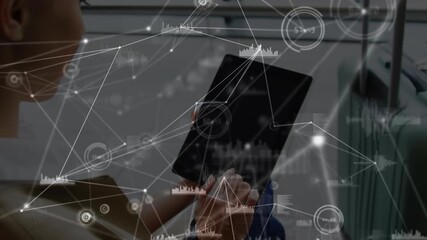 Animation of network of connections over caucasian businesswoman using tablet - Powered by Adobe