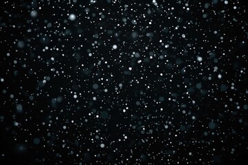 Fototapeta premium Black backdrop with falling snowflakes