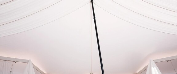 Stark white canvas tent, single black support pole, pure, clean