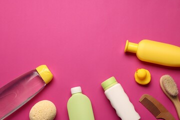 Baby bath accessories and care products on crimson background, flat lay. Space for text