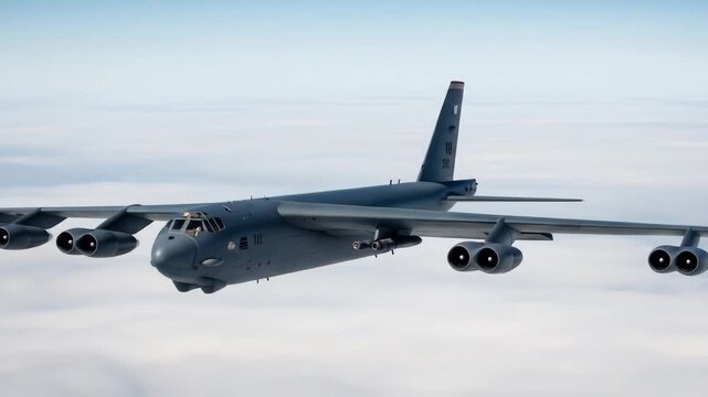B-52 Stratofortress bomber in flight over clouds, military aviation, airpower, defense, sky, airplane.