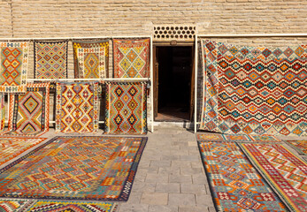the carpet on sale outside Toqi Sarrofon which in Persian as money changers dome