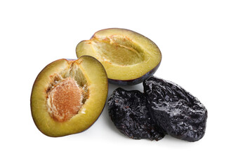 Dried prunes and fresh plum isolated on white