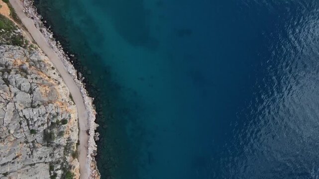 Aerial Mediterranean Sea top down near Paralia Arvantias beach in Nafplio Greece