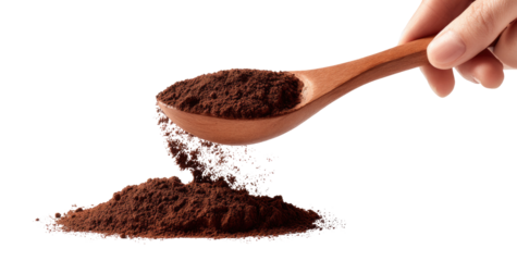 Wooden spoon pouring dark brown powder