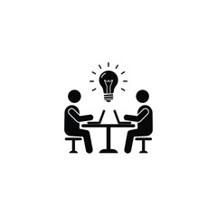 Two People Are Working On A Project With A Light Bulb