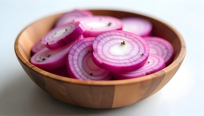 Sliced red onion in a rustic wooden bowl, studio shot on a seamless white background, soft natural lighting, shallow depth of field.
