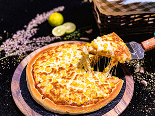 A hot pizza with gooey, stretchy melted cheese, freshly baked with a crispy golden crust.