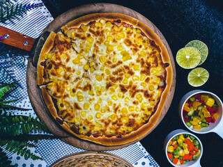 Delicious corn cheese pizza with golden melted cheese and sweet corn topping.