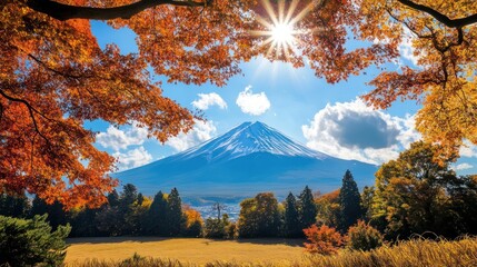 Stunning Autumnal Scene: Majestic Mountain Peak Under Sunny Sky and Vibrant Foliage