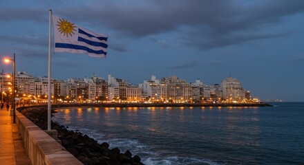 Stunning Evening Seascape of Montevideo's Waterfront with Flag and City Lights at Dusk