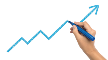 Close-up of a hand drawing a bright blue upward trending graph with a marker on a dark surface representing growth
