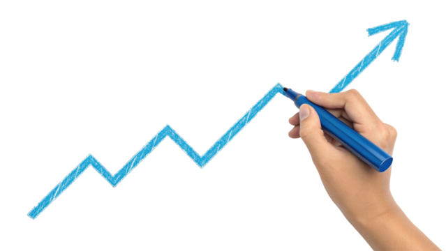 Close-up of a hand drawing a bright blue upward trending graph with a marker on a dark surface representing growth