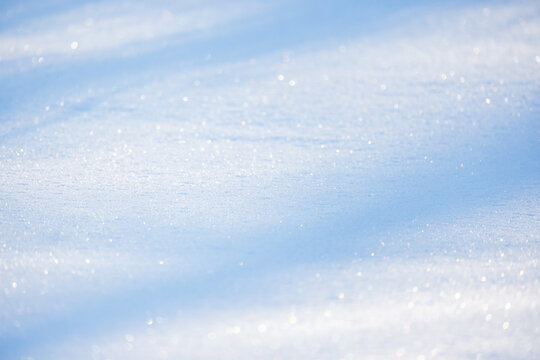 Fototapeta Glittering snowflakes shining under sunlight. Natural background photo
