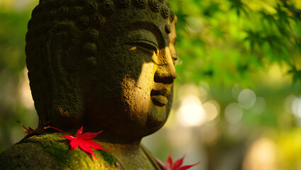 A stone Buddha statue in a garden, with its face illuminated by a beautiful, soft sunbeam, creating a moment of divine grace.