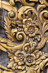 Beautiful carvel wooden decorations. Carved and gilded floral pattern