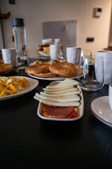 A table with plates of food and glasses of water. Scene is casual and relaxed
