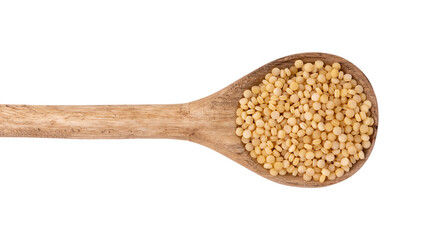 dry couscous in wooden spoon isolated on white background
