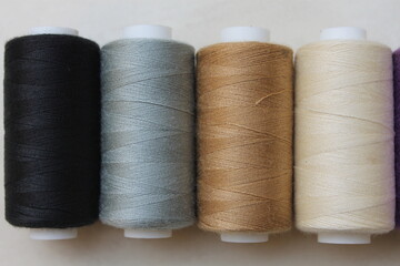 Colorful Sewing Threads on Bobbins Close Up Shot