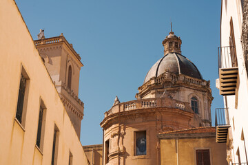 Old dome of historic church building under clear blue sky