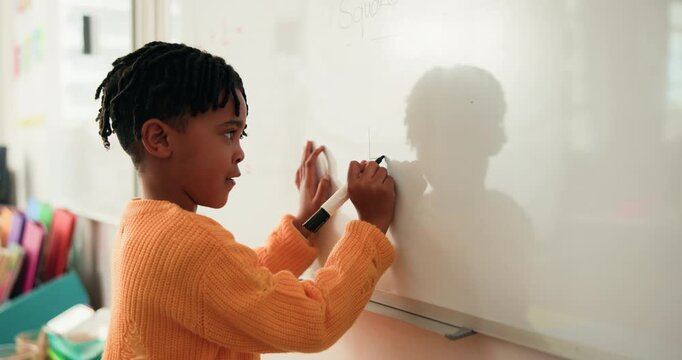 Child, student and writing on whiteboard in class for lesson, answer to question and problem solving. Black boy, kid and drawing shape for demonstration, education activity and solution for knowledge