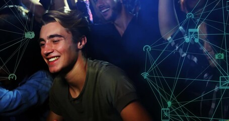 Animation of connections with icons over happy caucasian man having fun on concert - Powered by Adobe