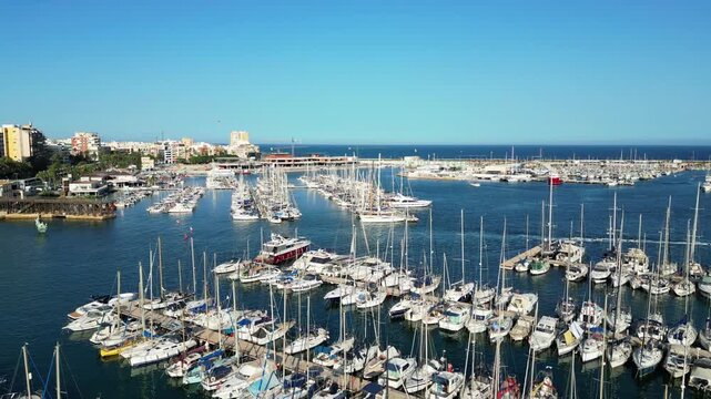 port with a lot of yachts and boats in dock with pier on a sunny day Drone footage mix 3in1 