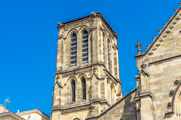 Bell tower of Saint-Pierre church in Bordeaux, France on a sunny day