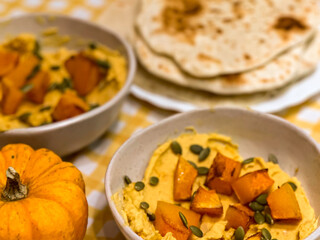 Healthy vegetarian meal with pumpkin dip and naan