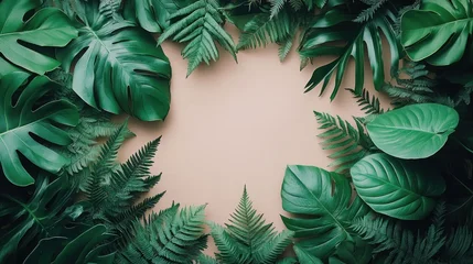 Fototapete Badezimmer Frame of vibrant green tropical leaves on a beige background  © waok.cepu67