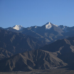 Fototapeta premium Glaciers on high peaks of the Zanskar Range, view from Leh, India.