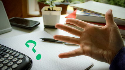 Problem-solving. Person expressing concern over homework or math with desk and calculator background. Education or work space background. a theme of inquiry or frustration.
