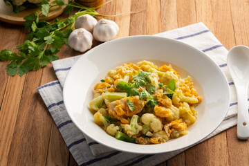 Stir fried Cauliflower with eggs in a plate.Healthy low carb diet.
