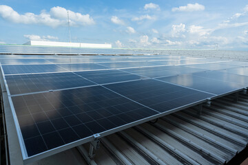 Solar panels and blue sky background.Solar cells farm on the roof.Photovoltaic modules for...