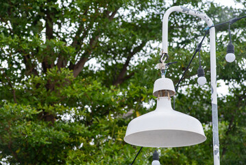 Hanging White Lamp with Greenery Background