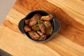 Deliciously Roasted Potatoes, Seasoned with Fresh Herbs, Served in a Cast Iron Bowl