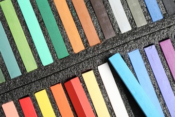 Set of colorful chalk pastels as background, closeup