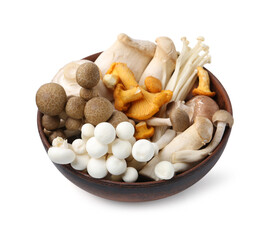 Different raw mushrooms in wooden bowl isolated on white