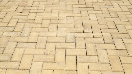 Yellow brick stone for a sidewalk and driveway. Pavement tiles texture and background
