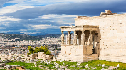 Fototapeta premium The Porch of the Caryatids on Erechtheion, Acropolis of Athens, Greece. The ancient Erechtheion temple with the beautiful Caryatid pillars in Athens, Greece.